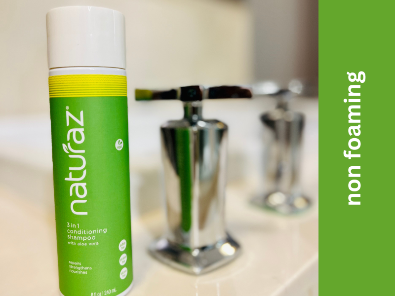 3-in-1 Conditioning Shampoo sitting next to faucet